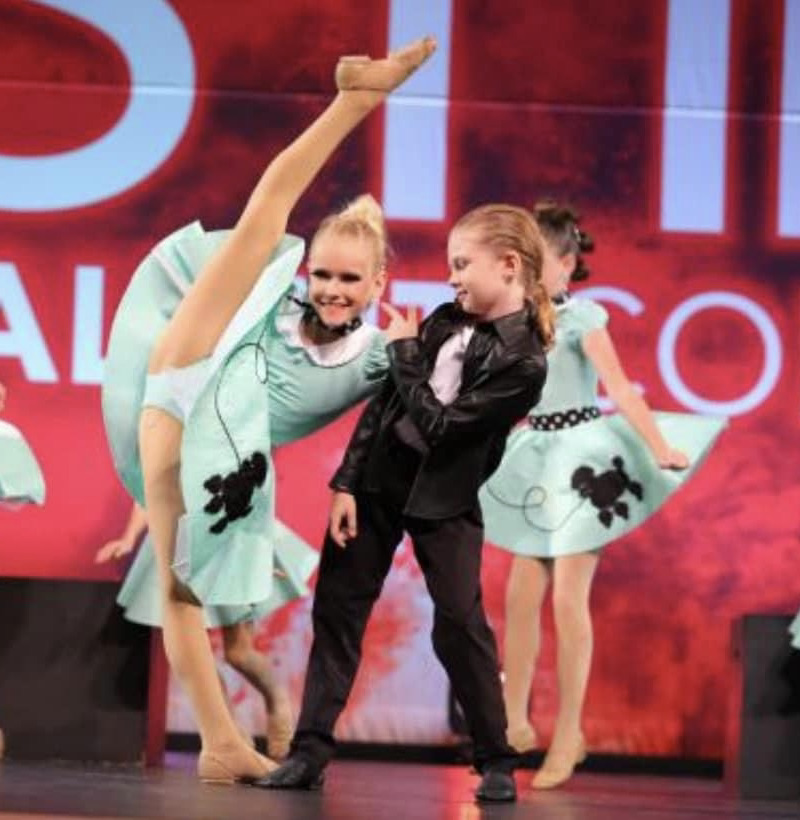 dancers in costume posing