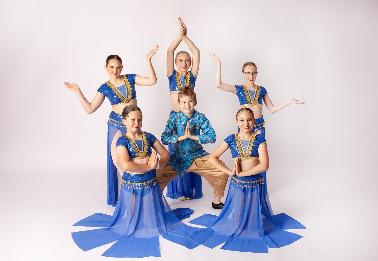 dancers in costume posing